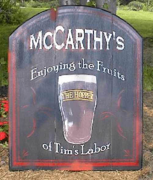 This wooden pub sign was custom made for someone's personal bar.